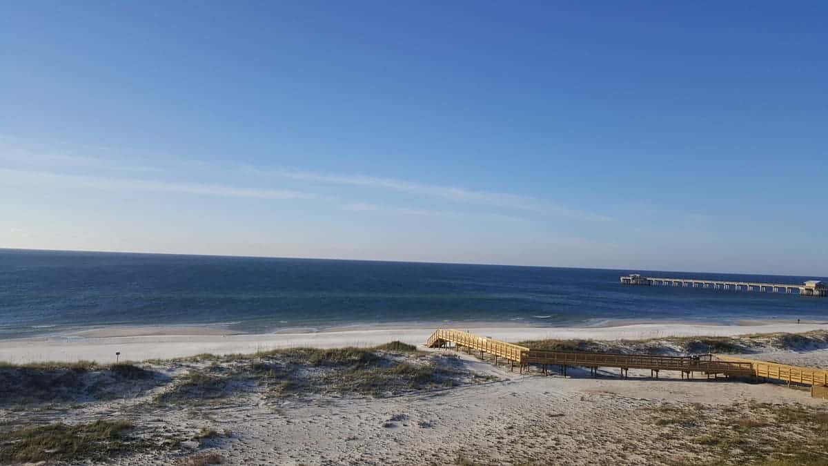 Dunes and beach boardwalk out to sand at Gulf State Park